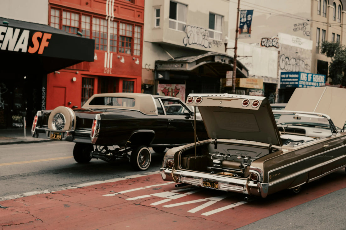 Classic vintage cars parked on a city street representing high-value specialty automotive cargo